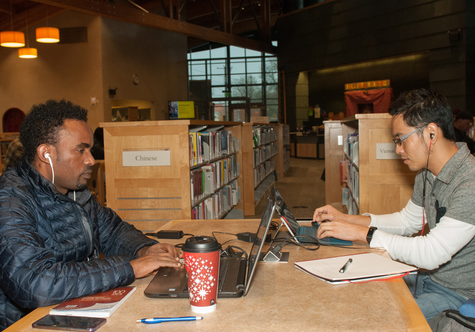 Library patrons using laptops at the Beacon Hill Branch