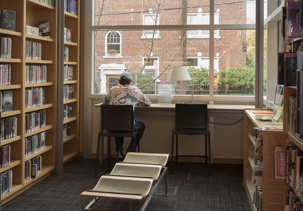 Library patron in teen area using a tablet at the Capitol Hill Branch