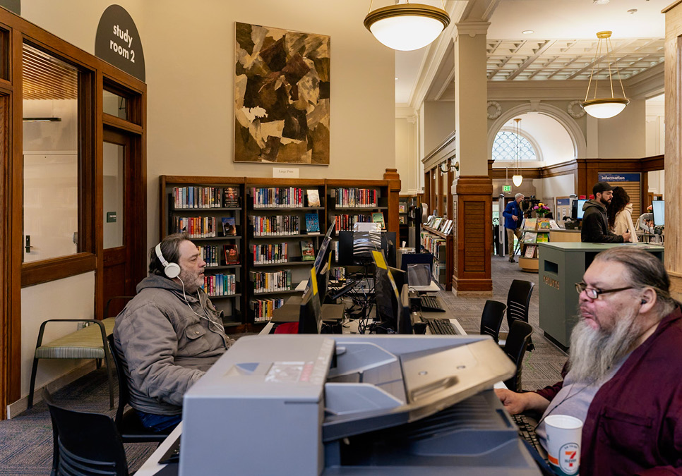 Library patrons using public computers at the Green Lake Branch