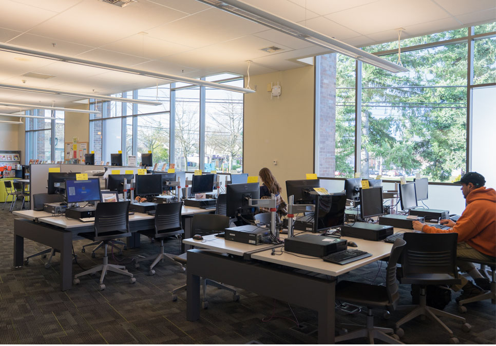 Library patrons using public computers at the Greenwood Branch