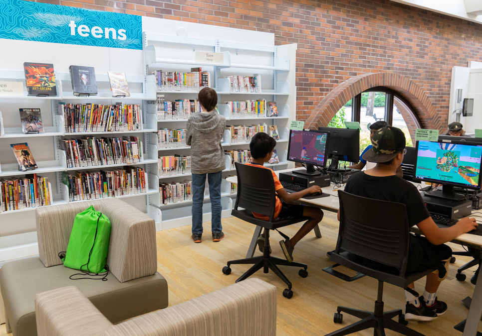 Patrons using public computers in the teen area at the Lake City Branch