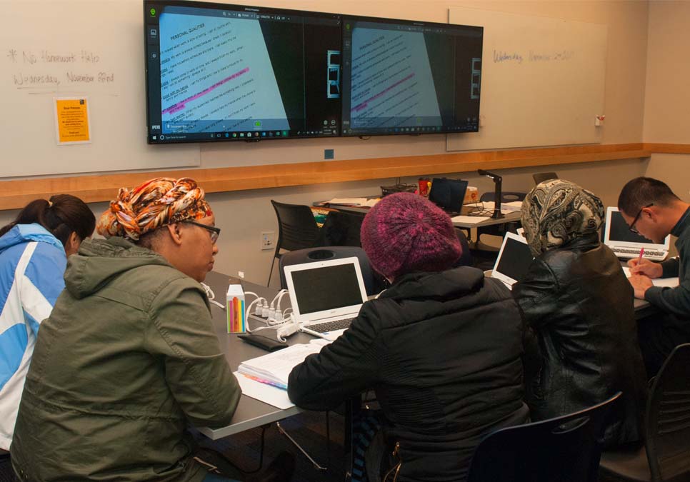 Library patrons getting homework help at the Rainier Beach Branch