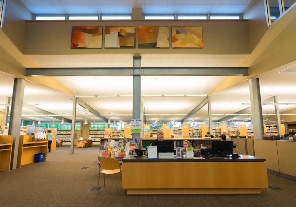 Library staff at service desk area at the Southwest Branch