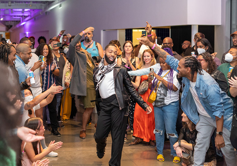 A person dancing in front of the audience at the Legendary Children event at the Olympic Sculpture Park in 2022