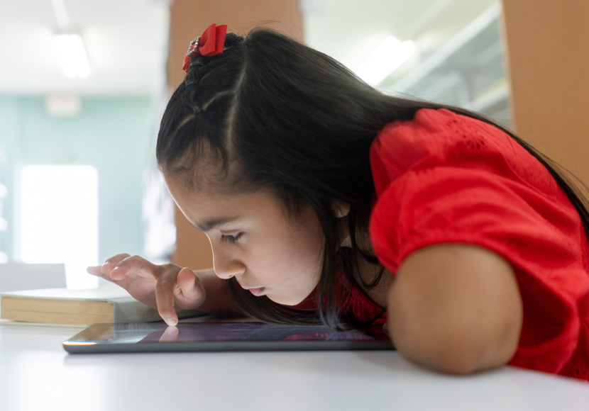 Child playing digital game