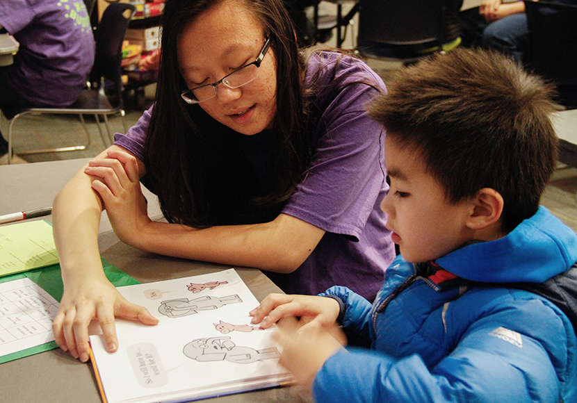 Person tutoring child.