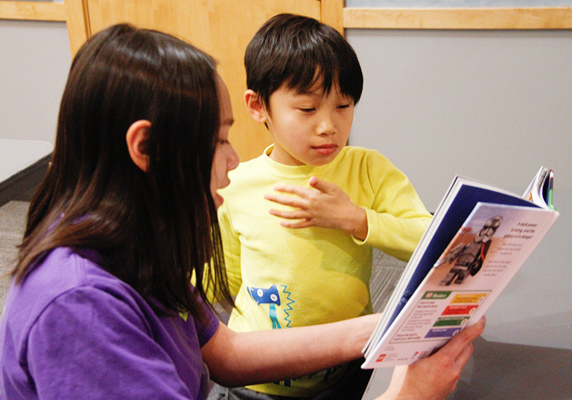 Person tutoring child.